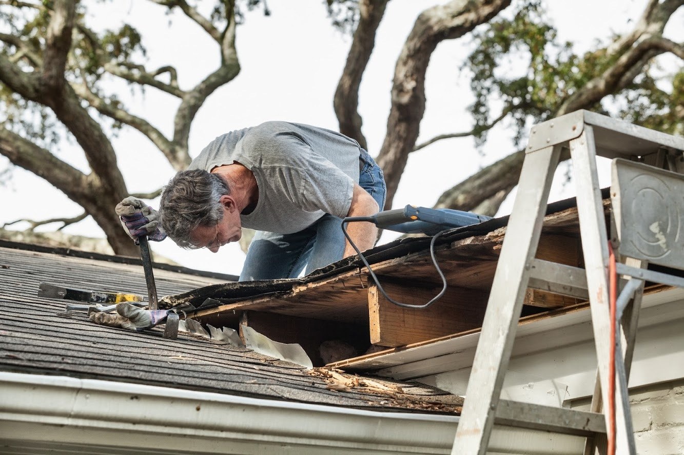 homeowner doing roof maintenance