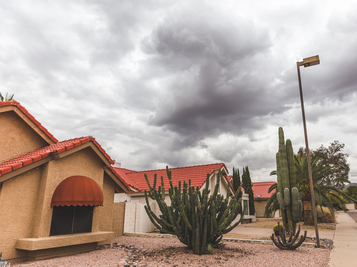A tiled roof In Arizona with impending storm clouds rolling overhead In Arizona,