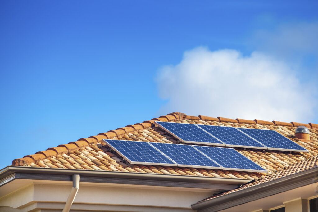 Solar panels on a residential roof. These panels offer both pros and cons.