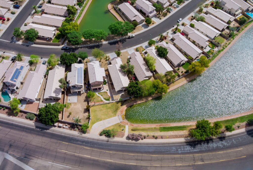 Near Carefree Arizona roofing, the aerial panorama view of residential houses neighborhood and apartment complex on USA