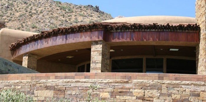 desert home structure with copper fascia and innovative roofing